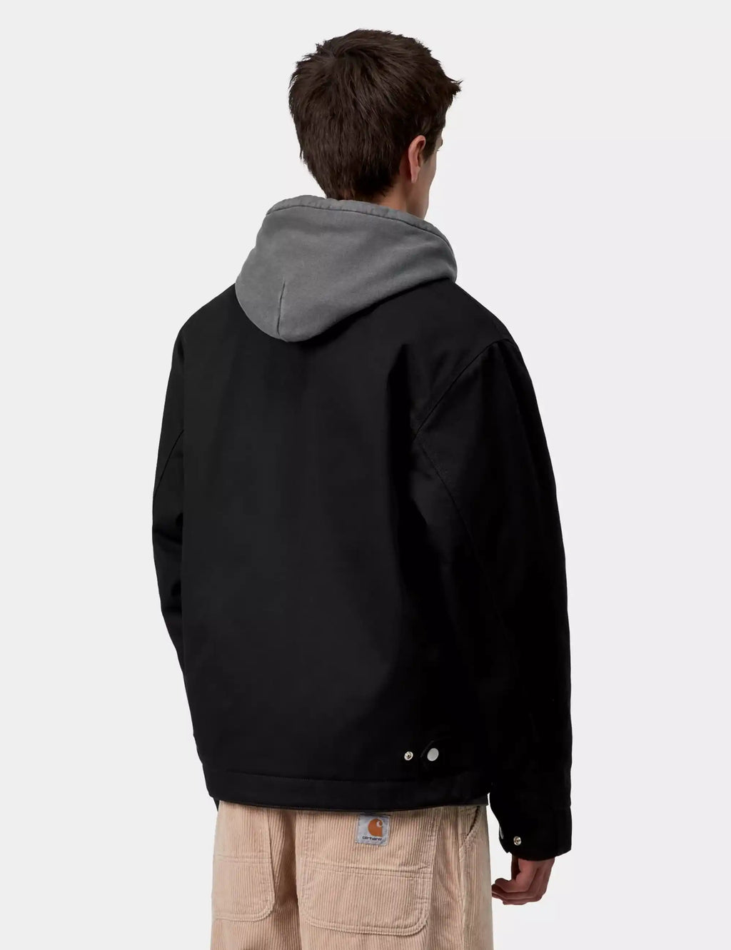 Black hooded jacket back view with gray hood lining and zip seam details