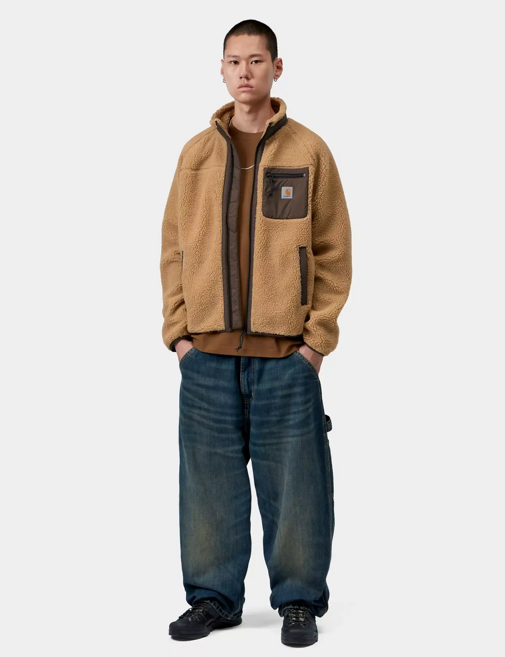 Tan sherpa fleece zip jacket on model, chest pocket, worn with jeans and boots