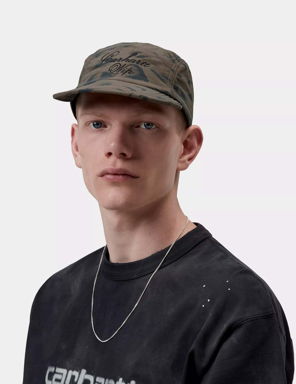 Duck feather print cap in dark cypress with black pattern, curved brim, cord adjuster