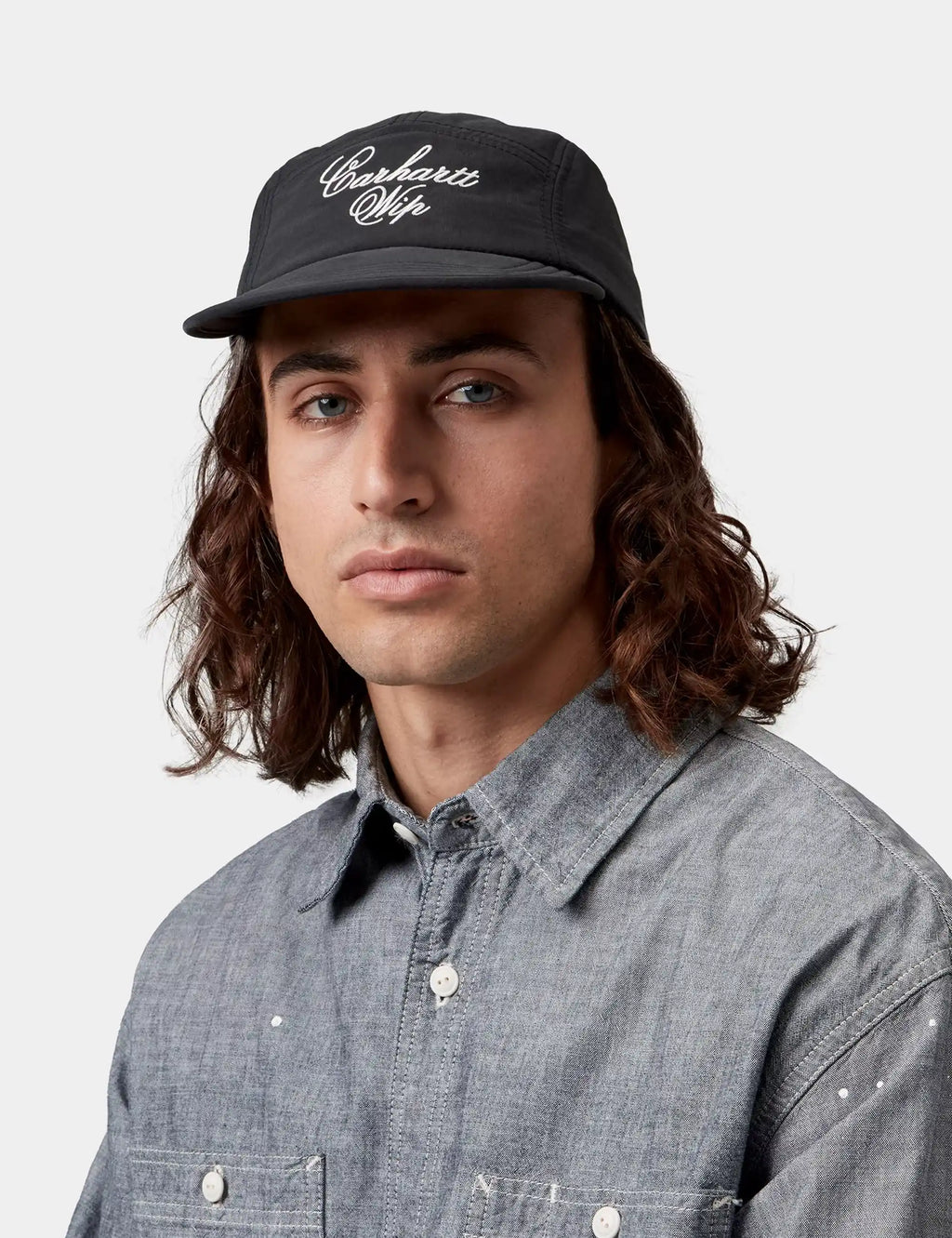 Travon black cap with Carhartt WIP logo front panel, curved brim and six-panel design