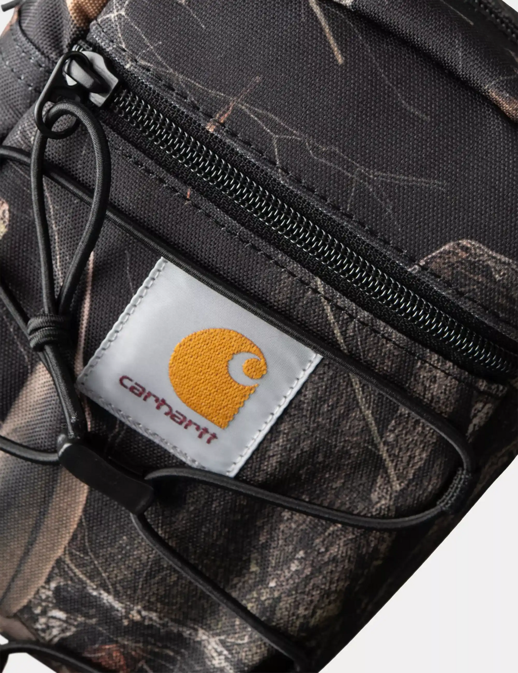 Black camo feather-pattern shoulder bag with front zip pocket and adjustable strap