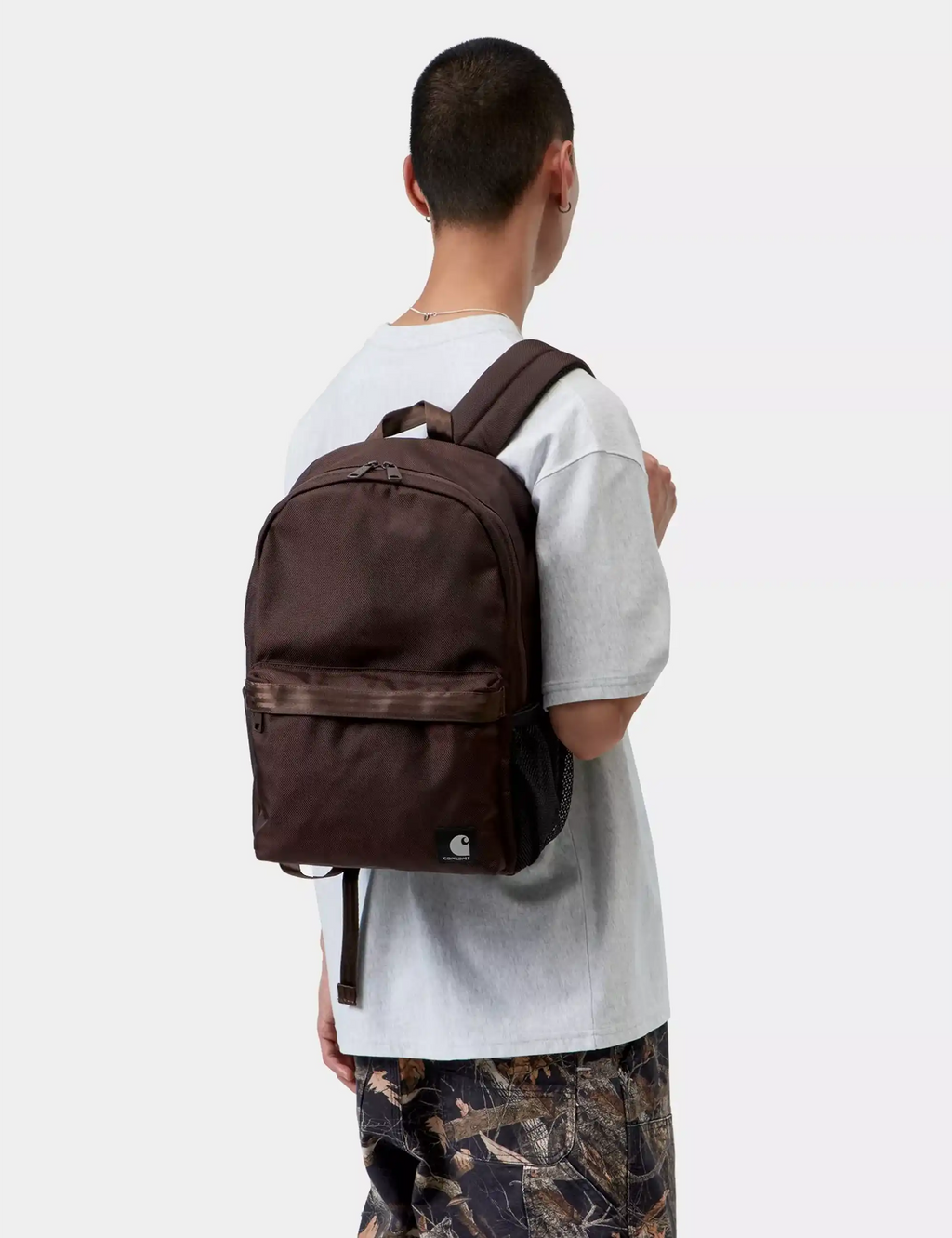 Carhartt WIP Richmond backpack on child, brown with front zip pocket and adjustable straps