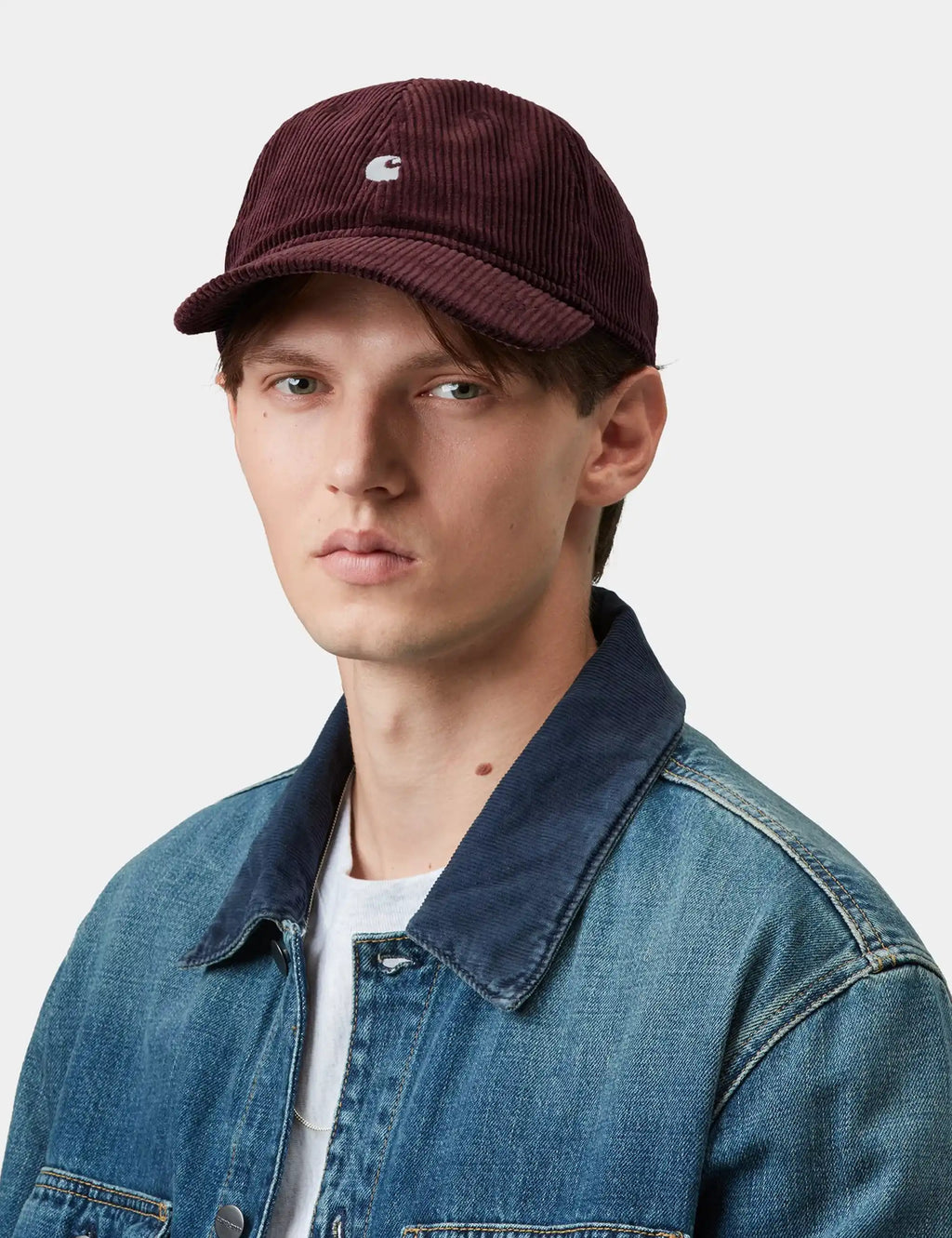 Harlem cord cap in burgundy corduroy with white logo, curved brim