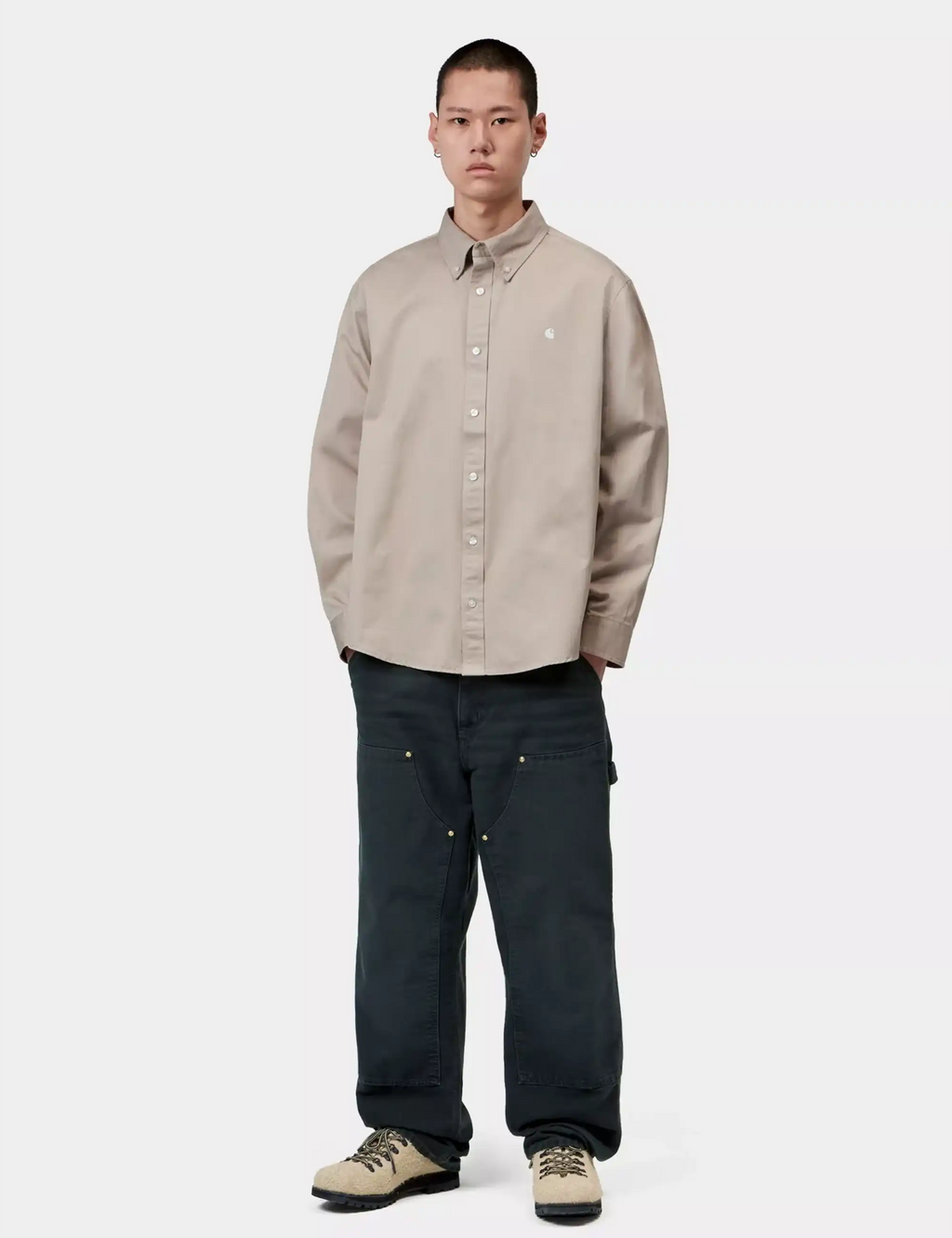 Light beige long-sleeve button-up shirt with pointed collar and button front.