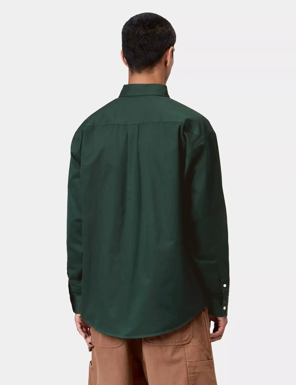 Dark green button-up long-sleeve shirt, back view with yoke seam and button cuffs
