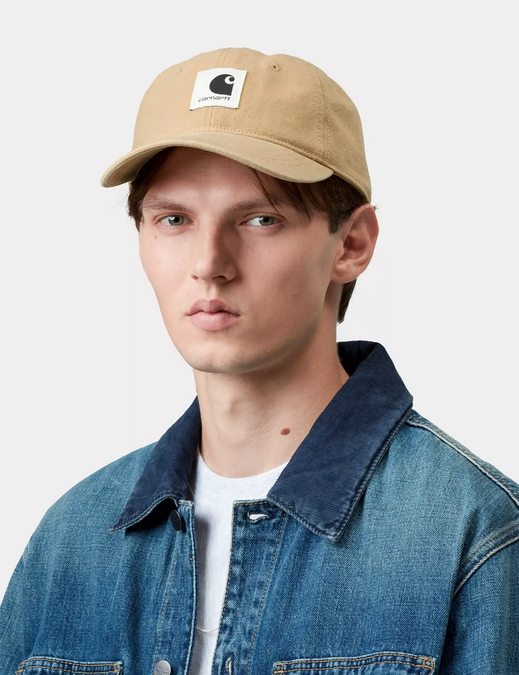 Beige canvas baseball cap with Carhartt logo patch on front