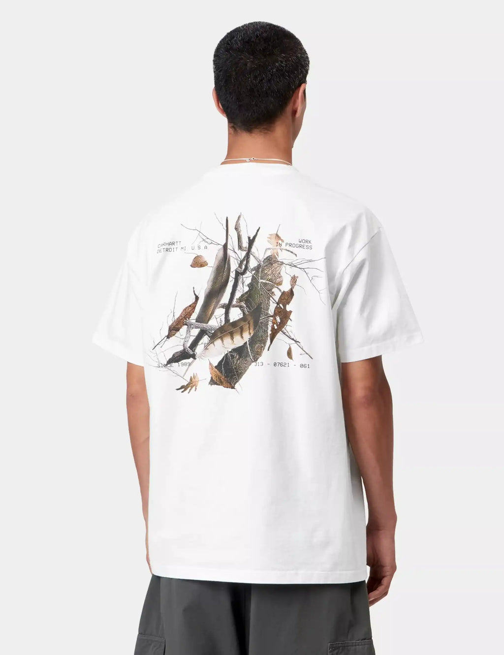 White crew-neck T-shirt with large back graphic, short sleeves and straight hem.