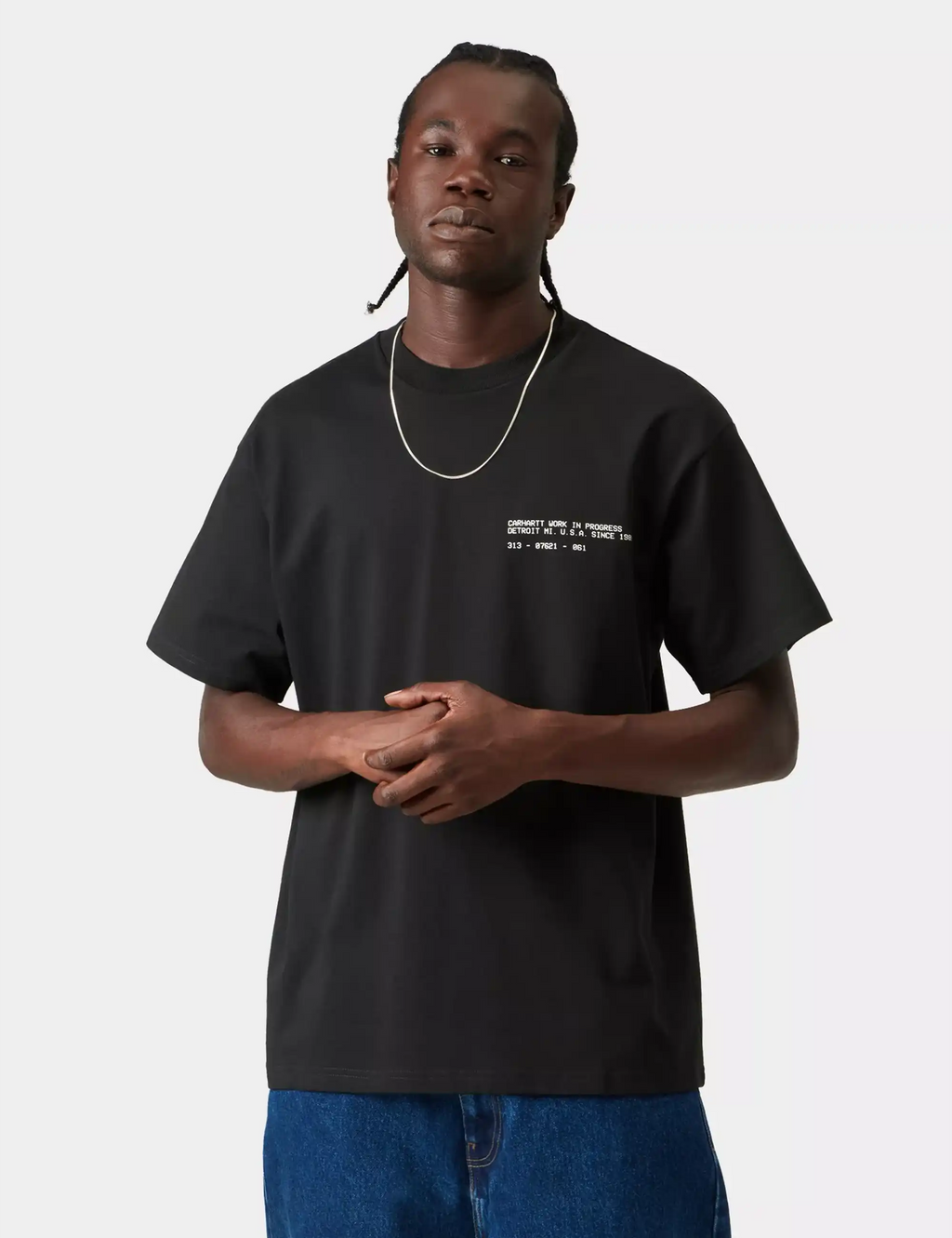 Black Carhartt WIP T-shirt worn by model, small chest graphic