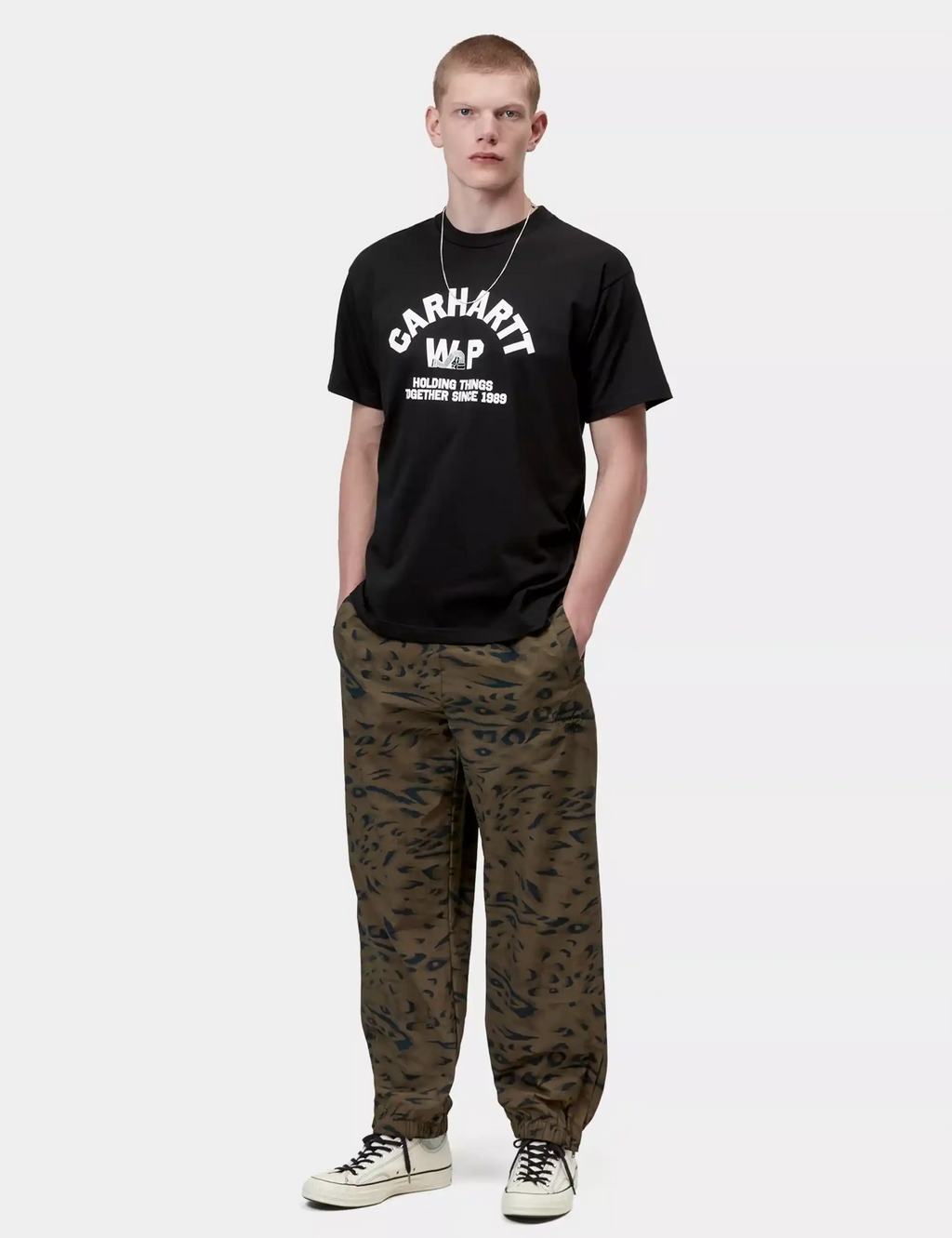 Black crew-neck T-shirt with Carhartt WP logo and holding-things text