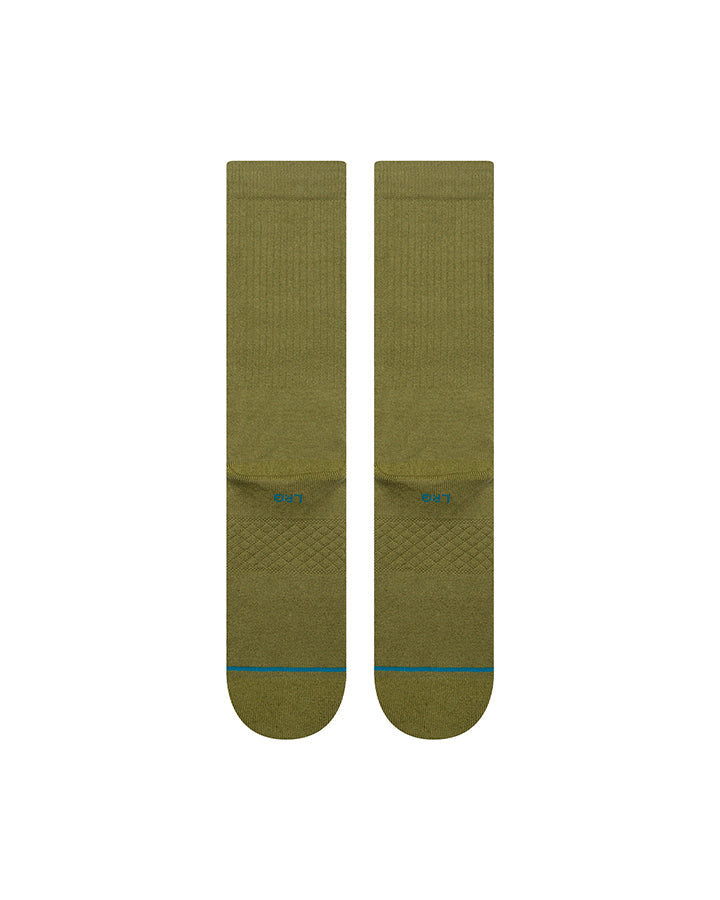 Pair of olive crew socks, circular logo on lower foot and blue-red stripe on toe