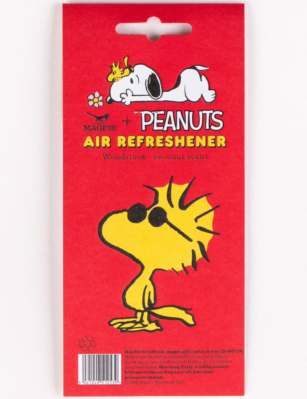 Air refreshener package showing Woodstock and coconut scent text