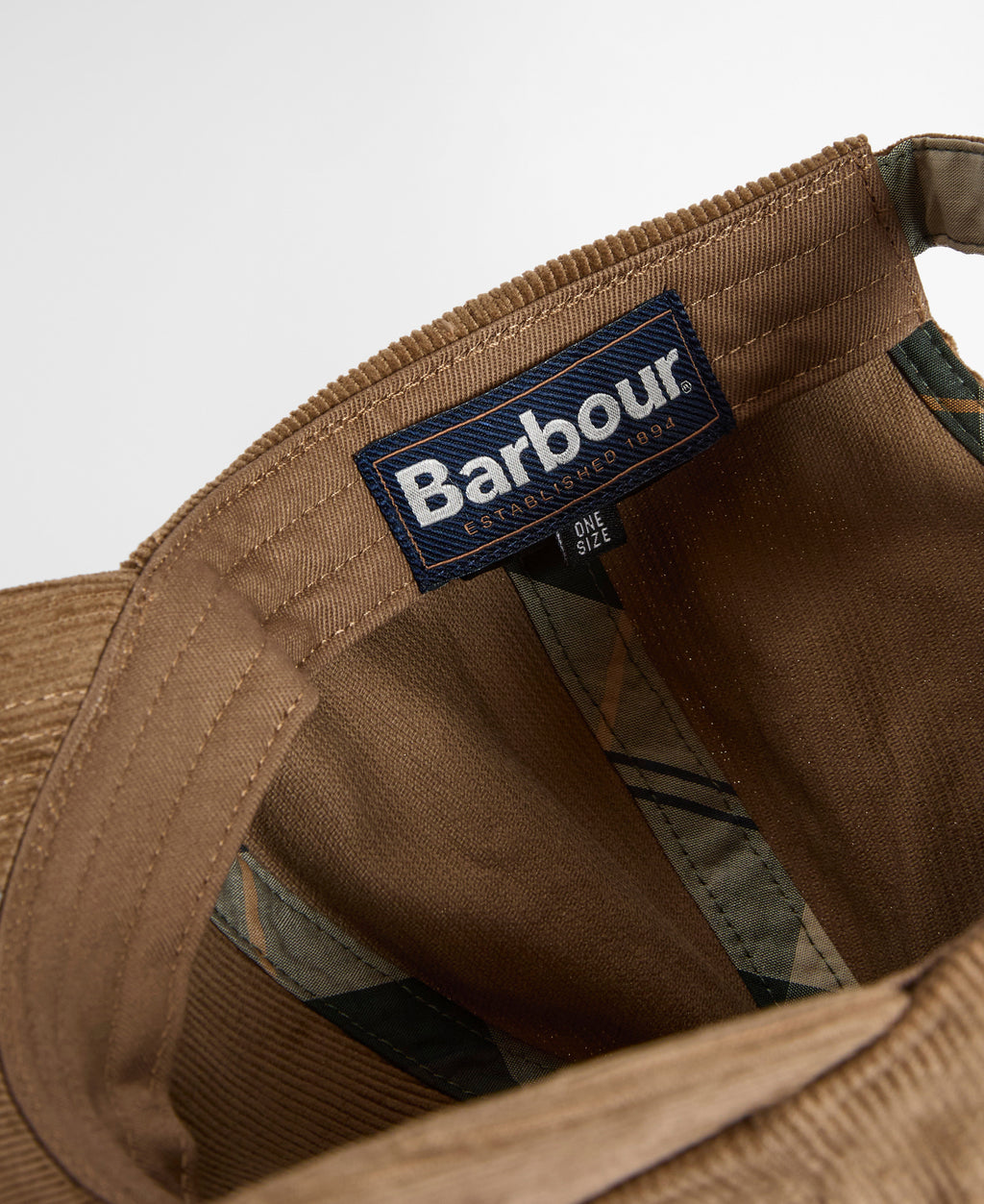Beige cord cap with Barbour logo patch and stitching detail