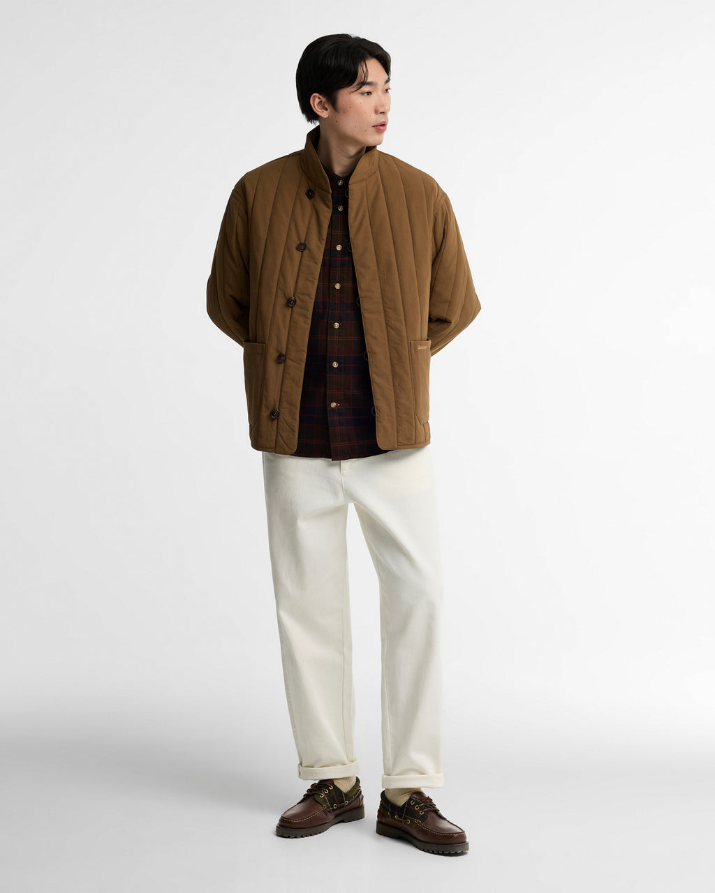 Sepia quilted jacket with stand collar and button placket, side view