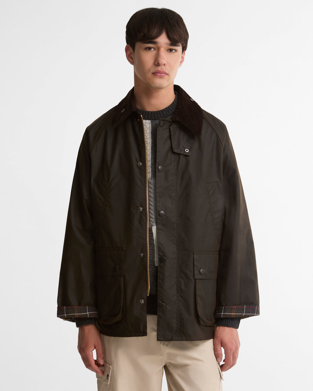 Dark brown wax jacket with snap front, cord collar, and chest pockets