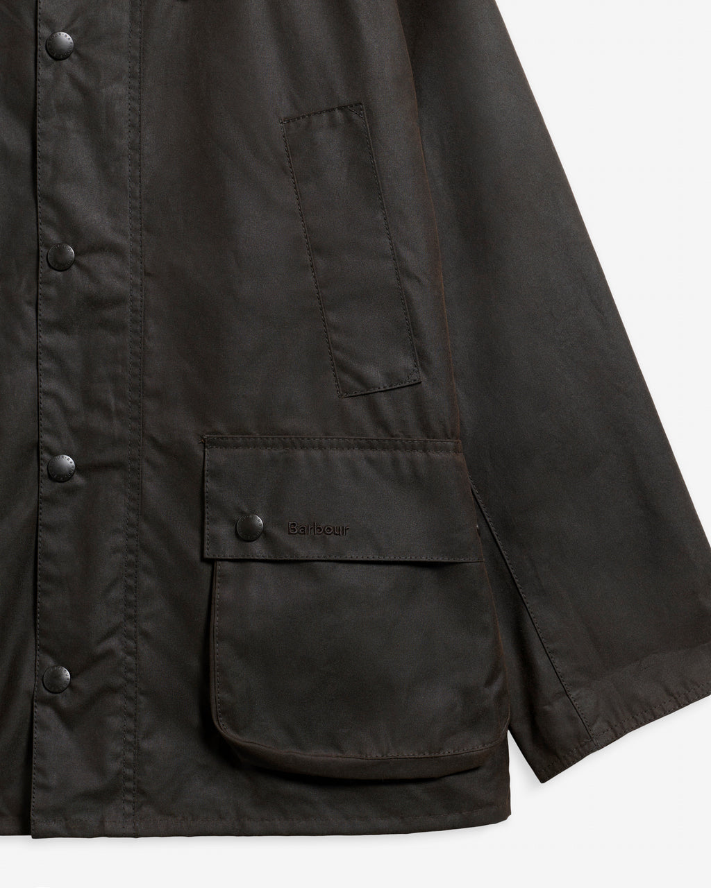 Dark brown wax jacket side pocket and button closure detail
