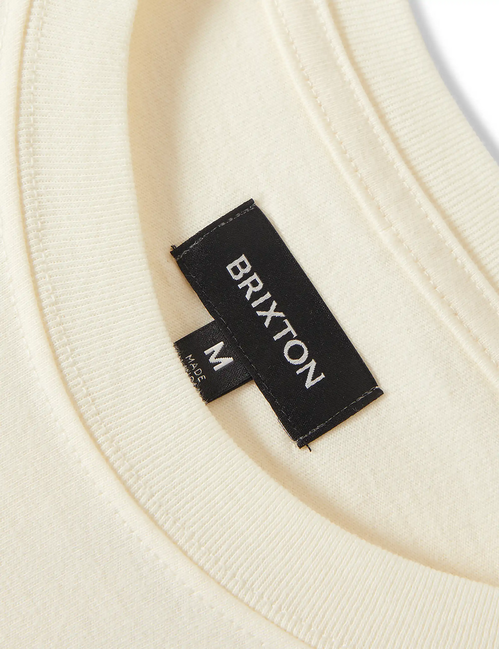 Natural T-shirt neckline label with BRIXTON text and size M
