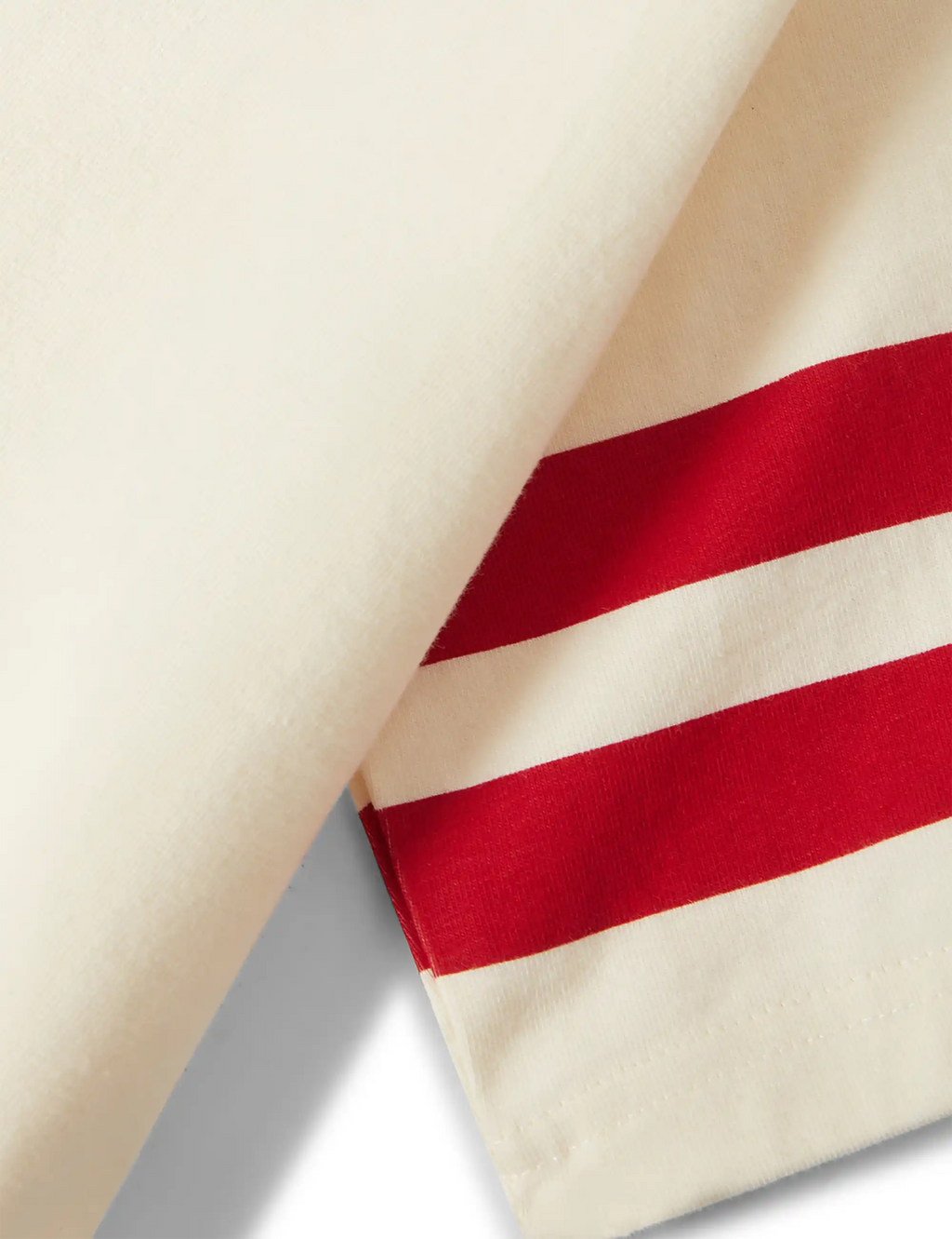 Natural T-shirt sleeve detail with wide red-and-white stripes