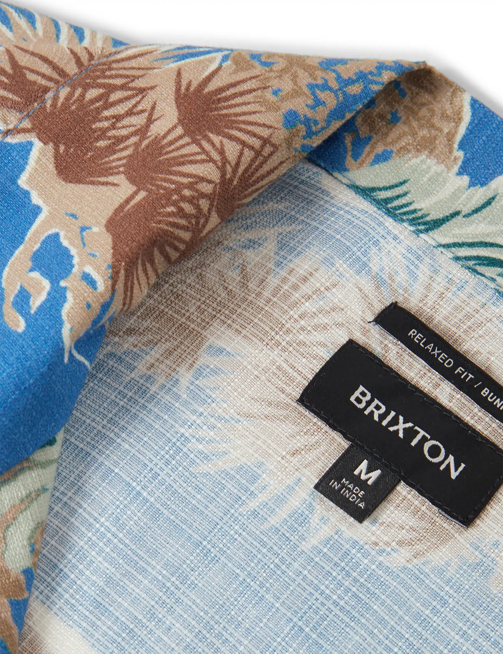 Relaxed fit woven Hawaiian shirt label on blue patterned fabric detail