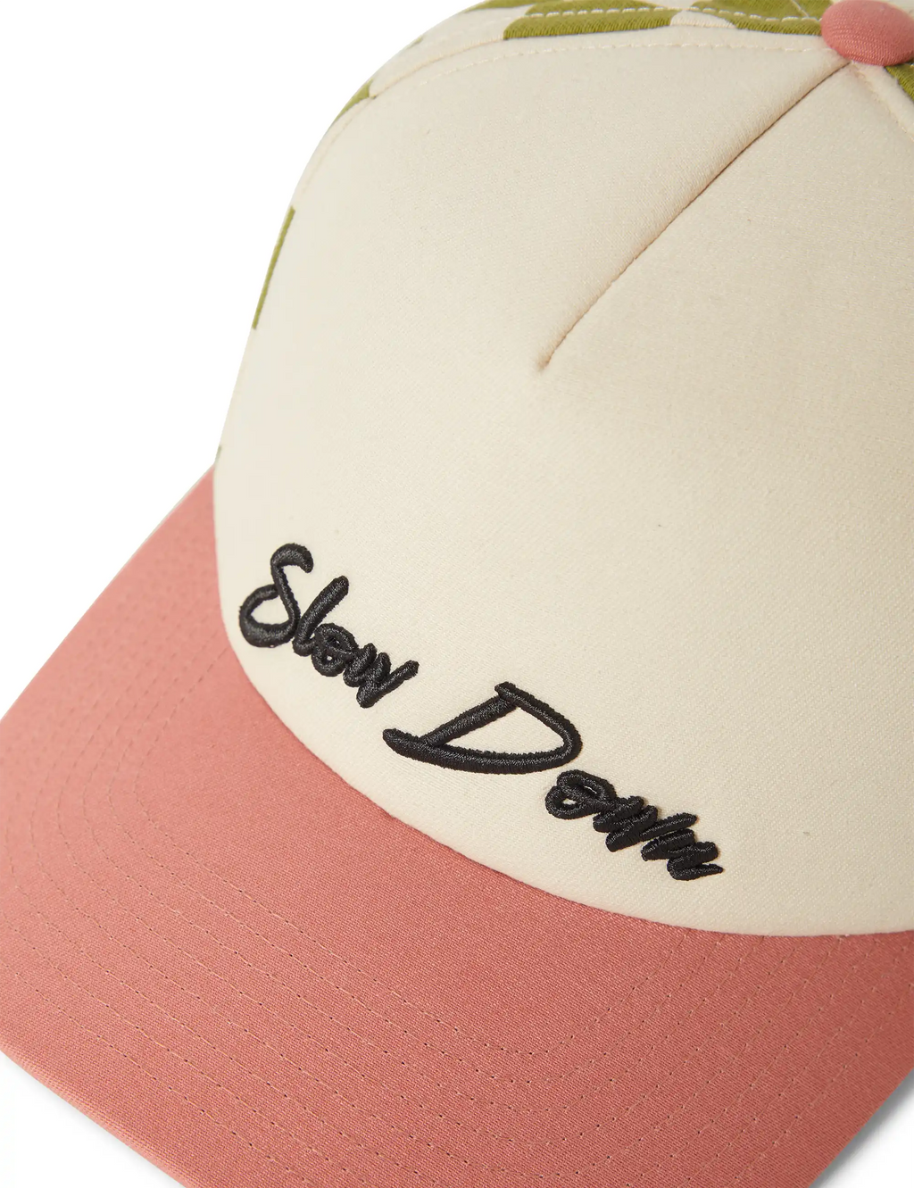 Embroidered logo on off-white crown of a snapback cap with coral contrast brim