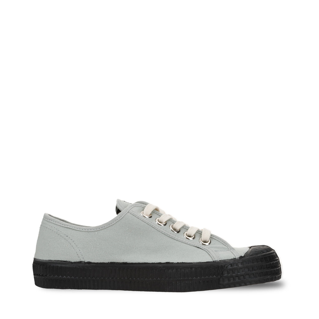 Sage canvas low-top sneakers with black rubber sole and lace-up eyelets