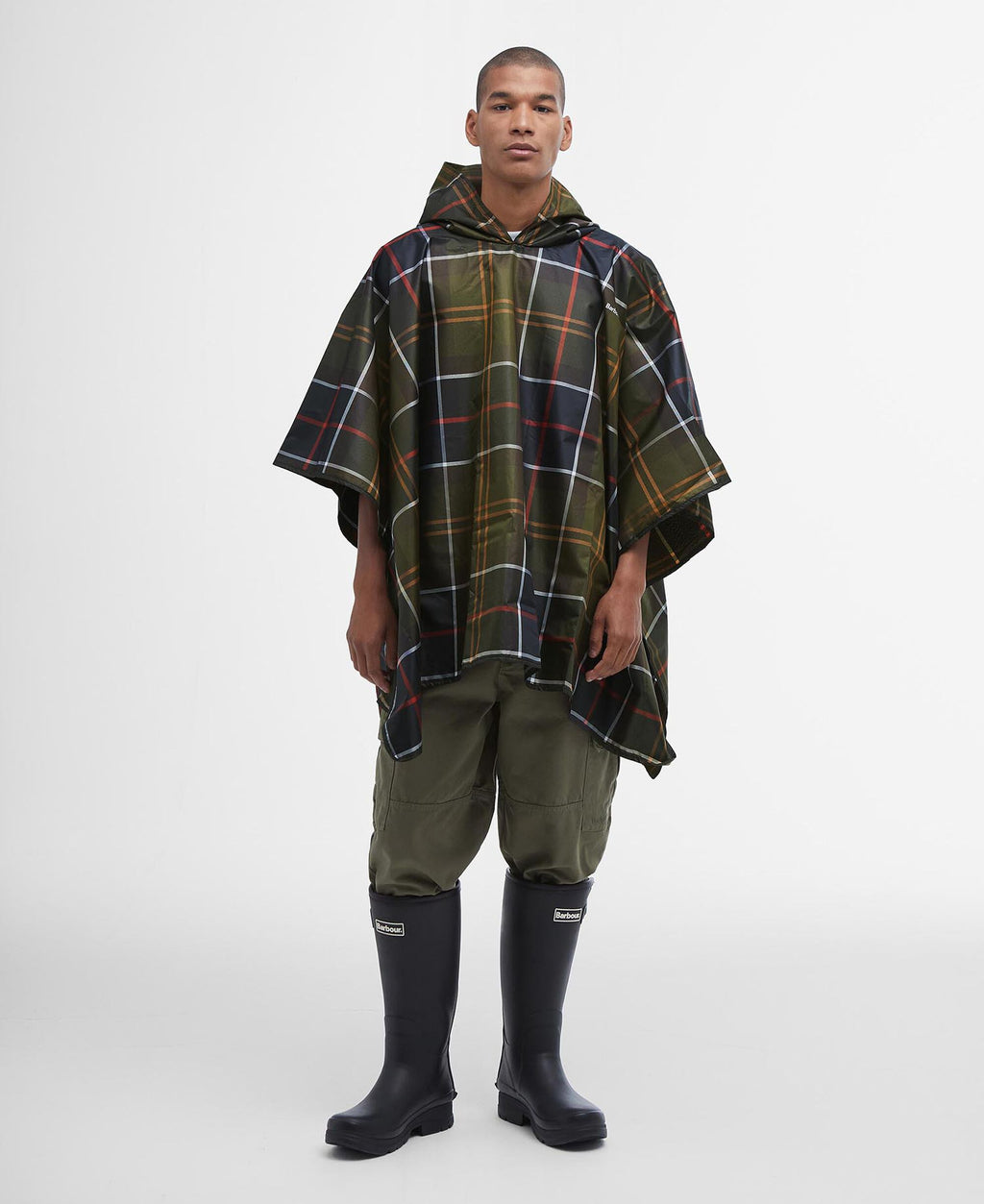 Tartan showerproof poncho with hood, loose cape cut, dark green plaid with red lines