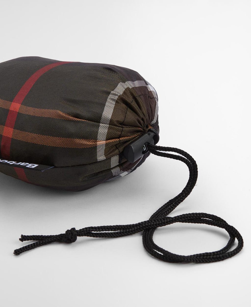 Tartan drawstring storage bag for poncho, dark plaid fabric with black cord