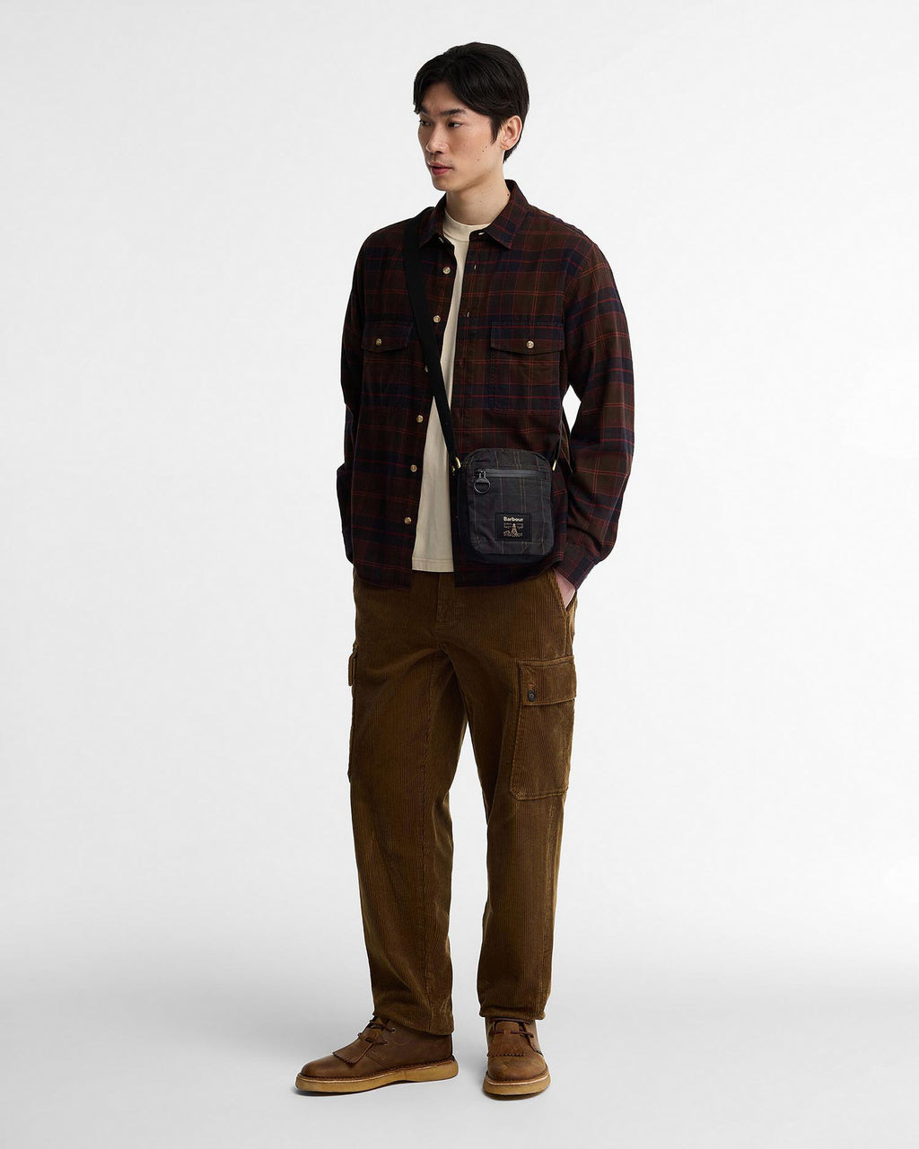 Barbour Field Tartan Wax Crossbody Bag in Dark Classic Tartan, worn