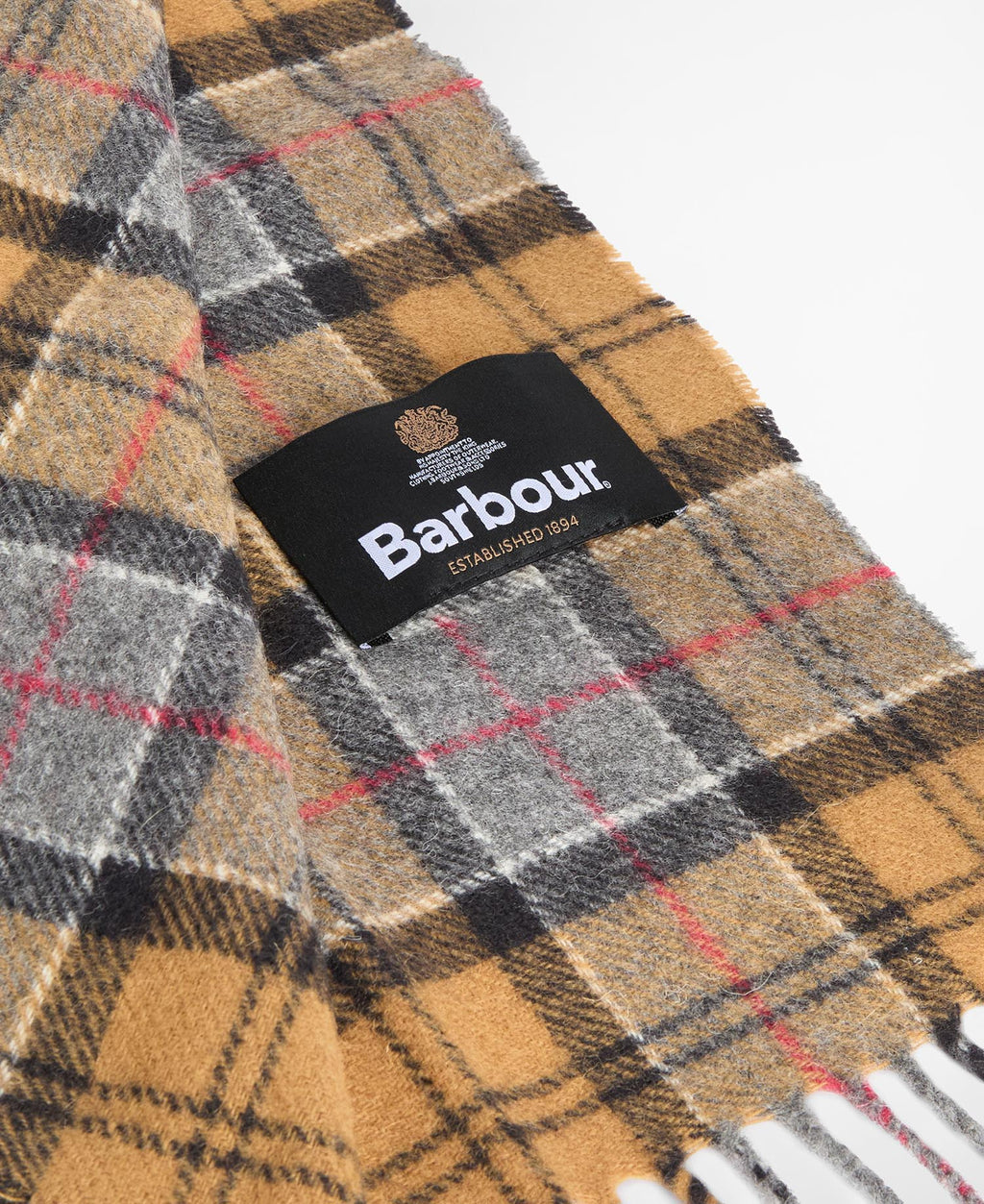 Dark tartan lambswool scarf detail with Barbour label and fringe