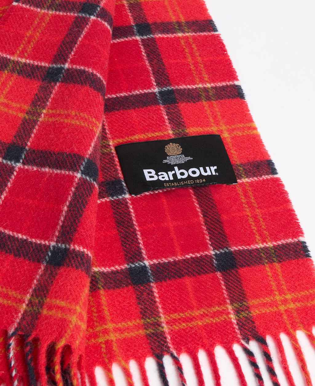 Red and black tartan scarf with Barbour label and fringed edge