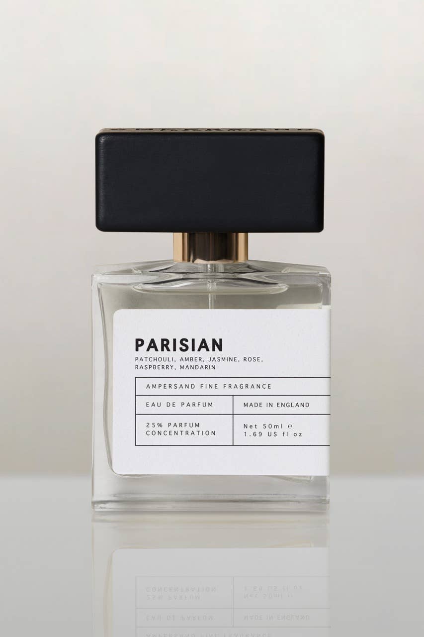 Unisex Eau de Parfum bottle, clear glass with black cap and white front label