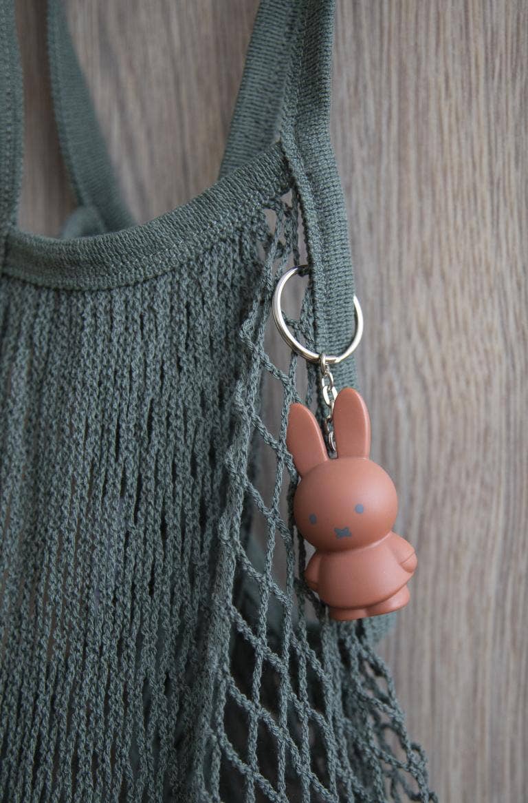 Terra red Miffy bunny keyring on teal woven bag, metal ring attachment