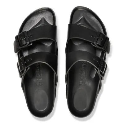 Pair of black EVA sandals with wide toe strap and heel buckle, flat tread sole