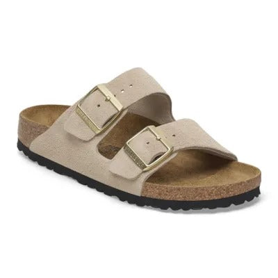 Birkenstock Arizona sandal in Sandcastle suede, three-quarter view showing twin straps and gold buckles