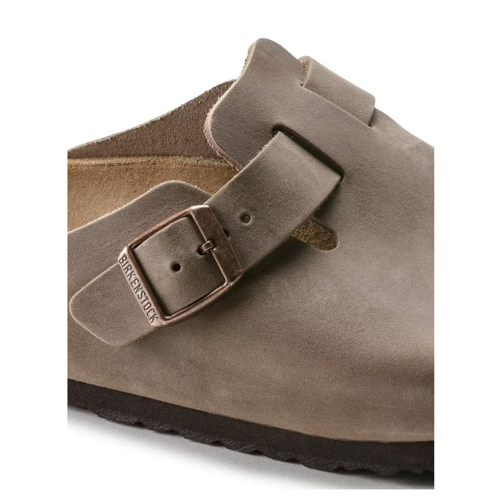Birkenstock Boston clog in Tobacco Brown, close-up of adjustable buckle and oiled leather upper