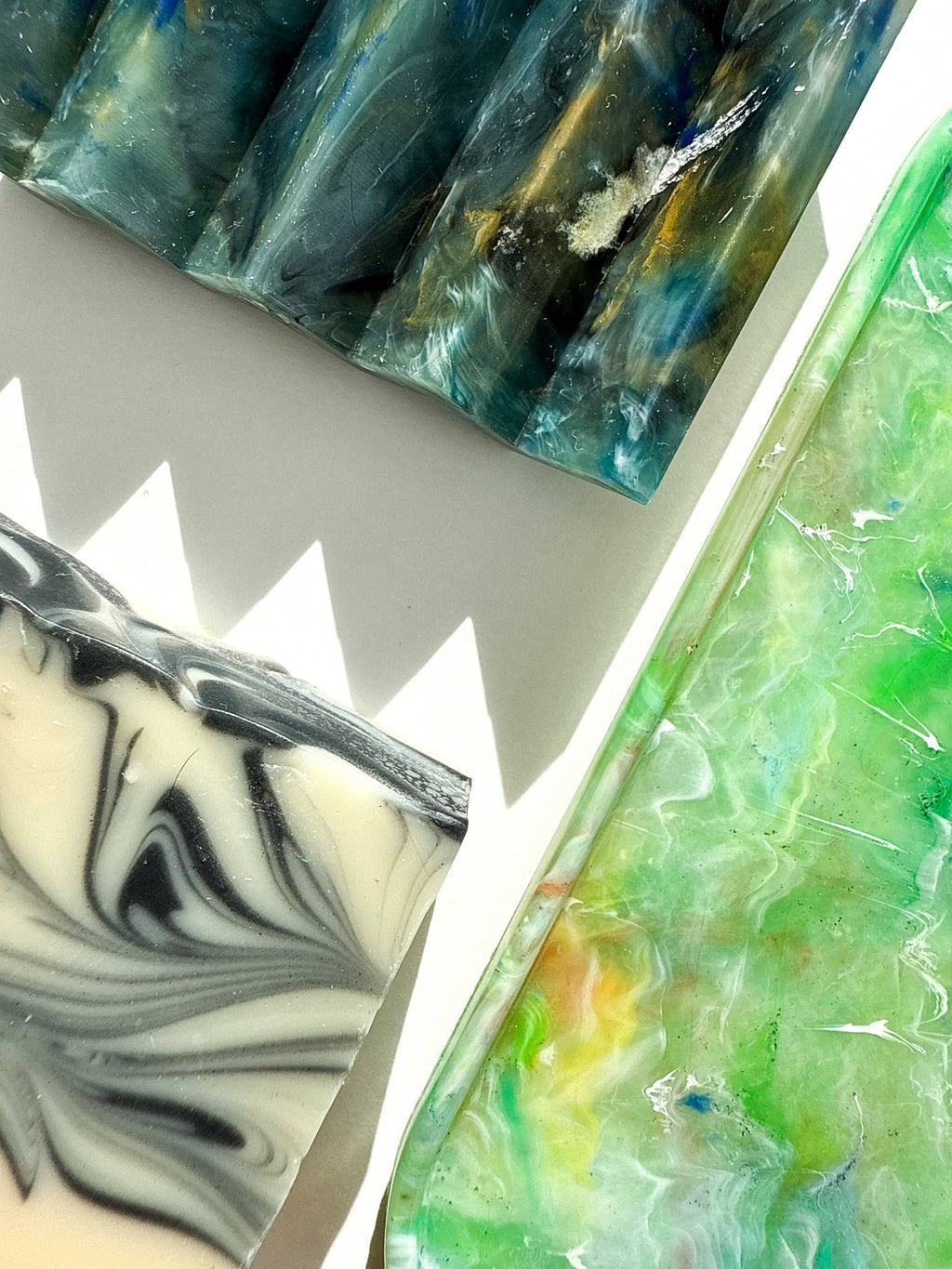 Green translucent marbled tray with rounded rim and glossy surface highlights.