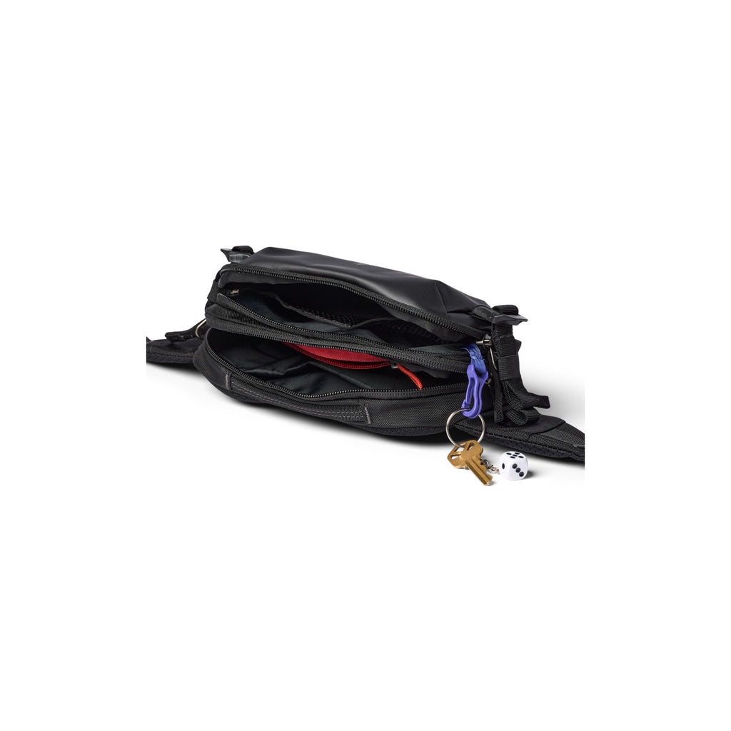 Black hip pack open to show main compartment and zipper; keys on clip