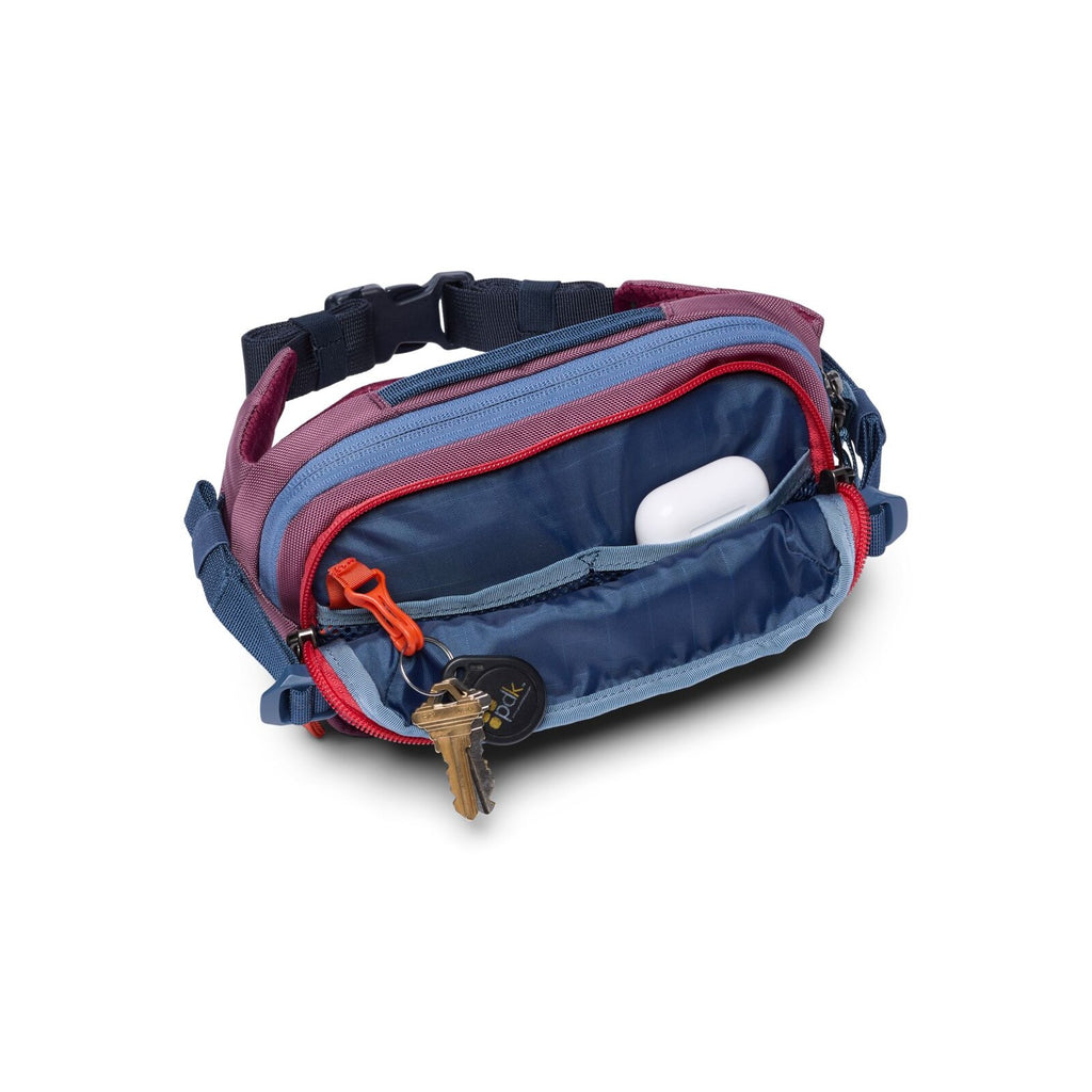Cotopaxi Allpa X 1.5L Hip Pack in Fig, open showing internal mesh pocket and contents