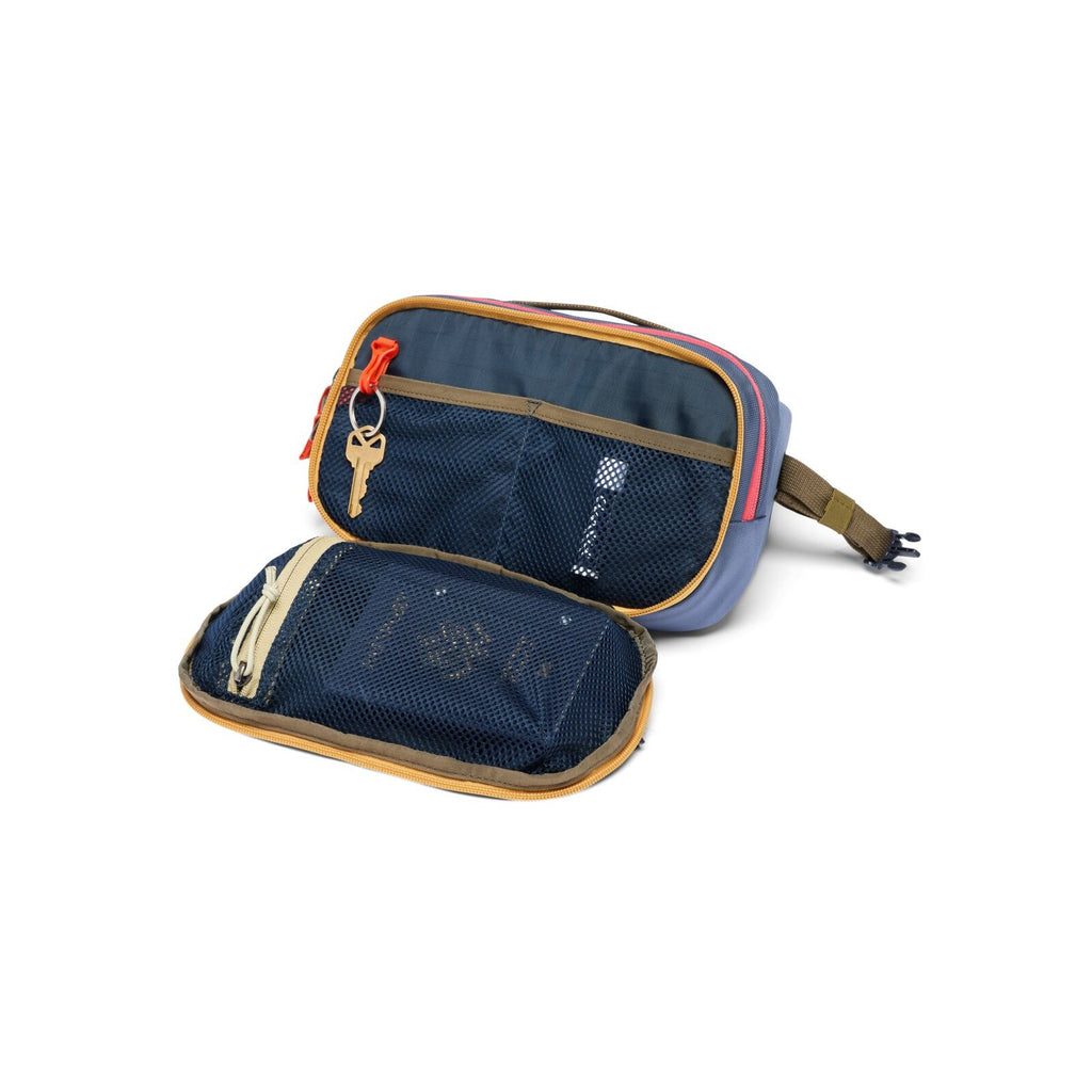 Cotopaxi hip pack open with mesh pocket, zip top, and orange zipper accents