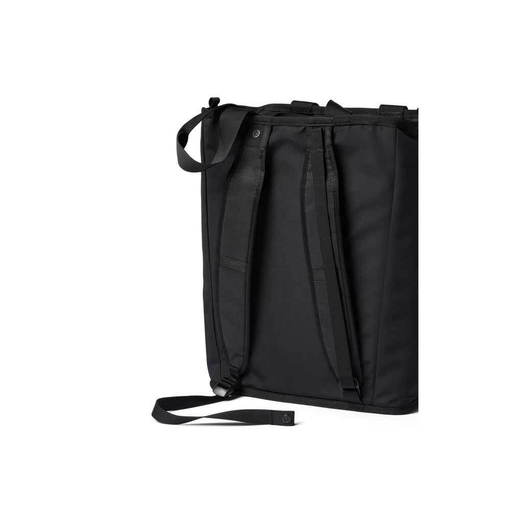 Black convertible tote bag close-up with top handle and adjustable straps
