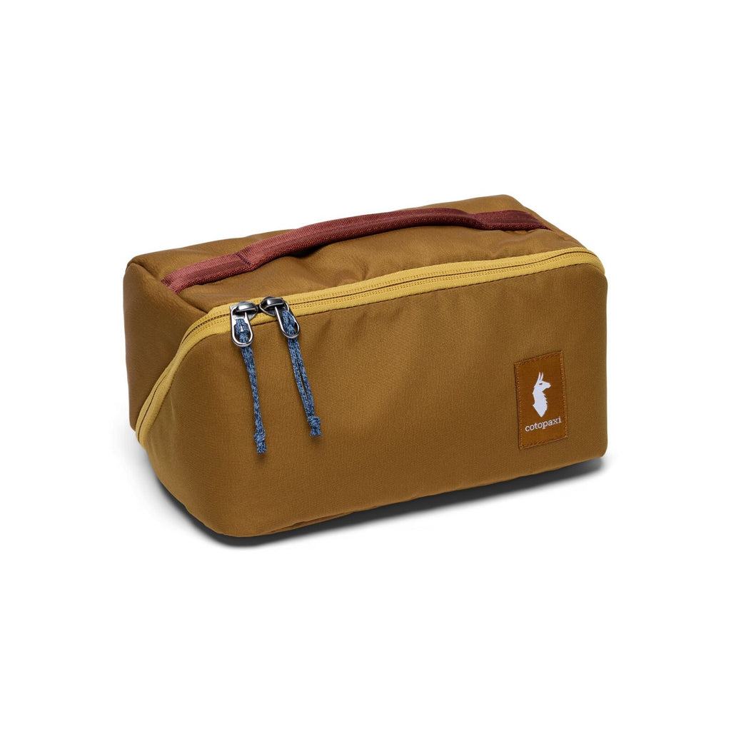 Cotopaxi Viaje Toiletry Kit in Bronze, front view with llama logo and contrast zip