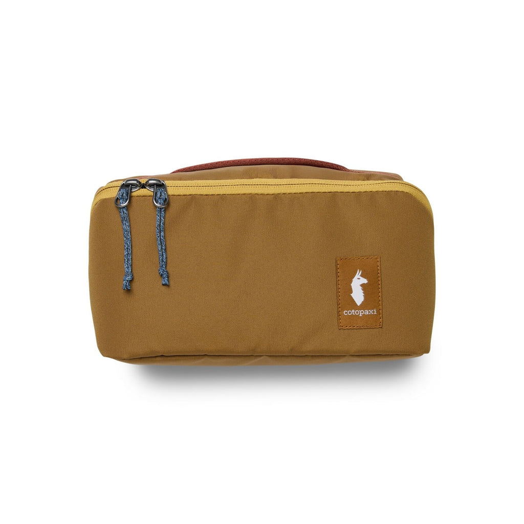 Cotopaxi Viaje Toiletry Kit in Bronze, angled view showing zip pulls and grab handle