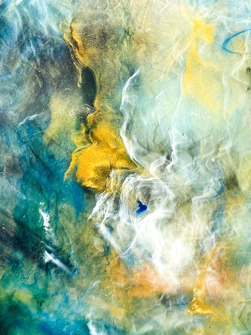 Marbled recycled plastic tray close-up surface, teal, blue, yellow, and white swirls