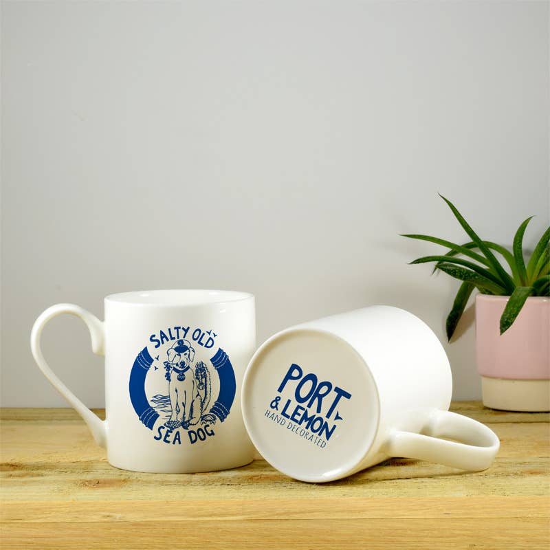 White bone china mug with blue "Salty Old Sea Dog" emblem
