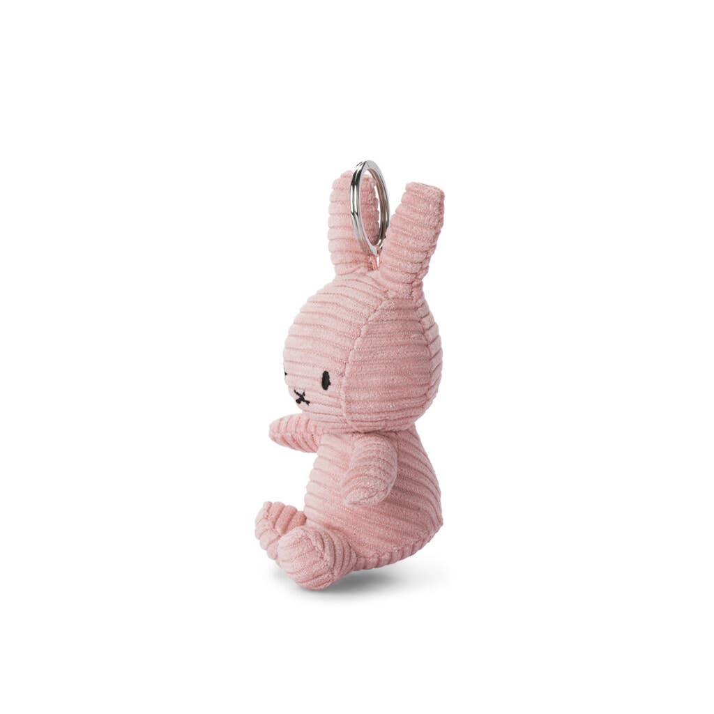 Pink corduroy rabbit keychain with metal ring, side view