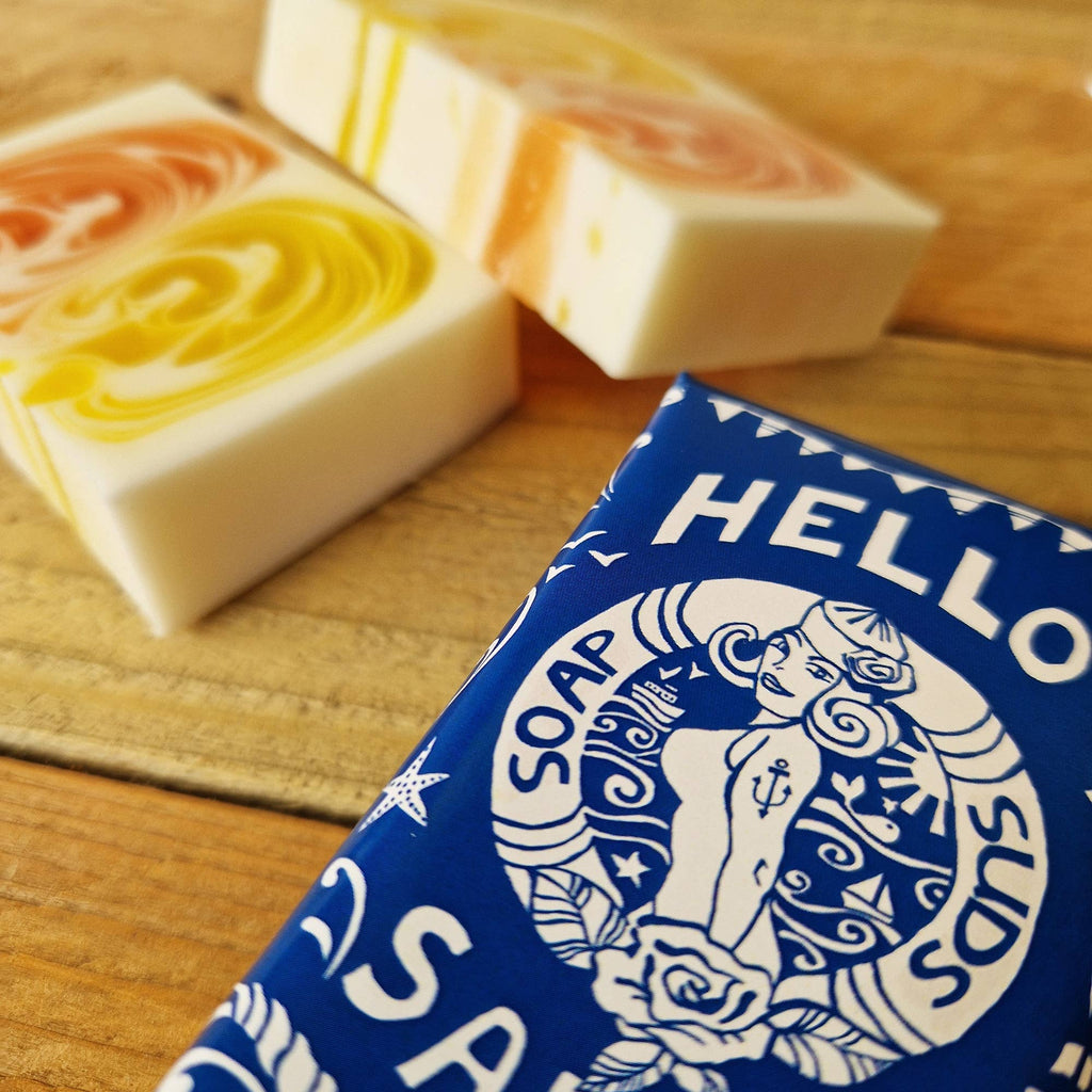 Hand crafted Hello Sailor soap bar in blue nautical wrapper, close-up