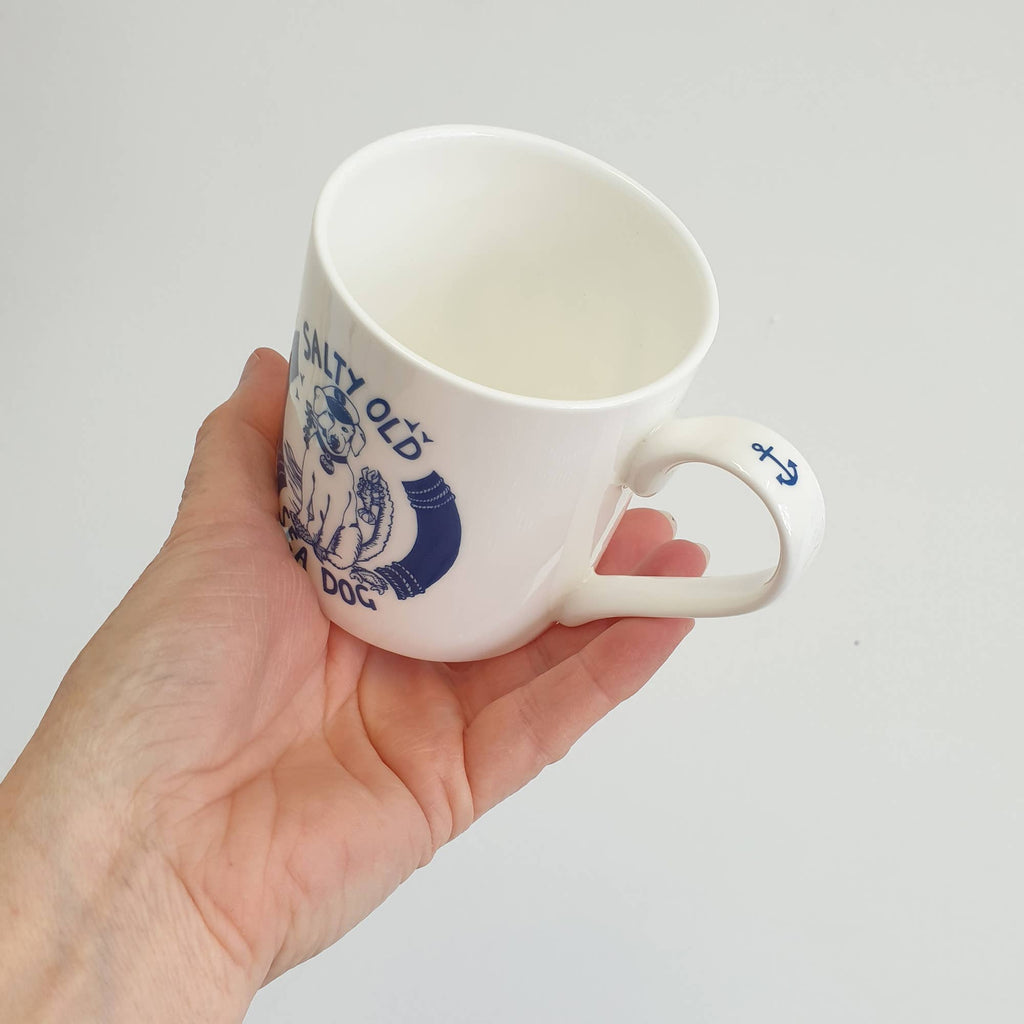 White bone china mug with blue sea-dog graphic and side handle