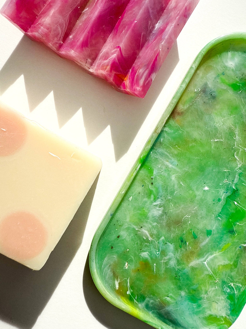 Green translucent marbled tray with rounded rectangular rim.