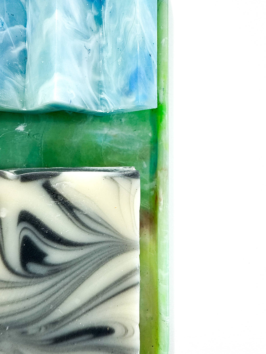 Green translucent plastic tray with rounded edges and marbled surface.