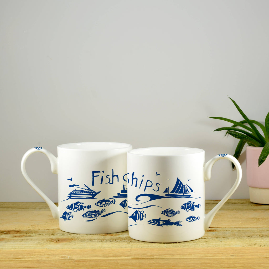 Bone china mugs, white with blue fish and ship motifs