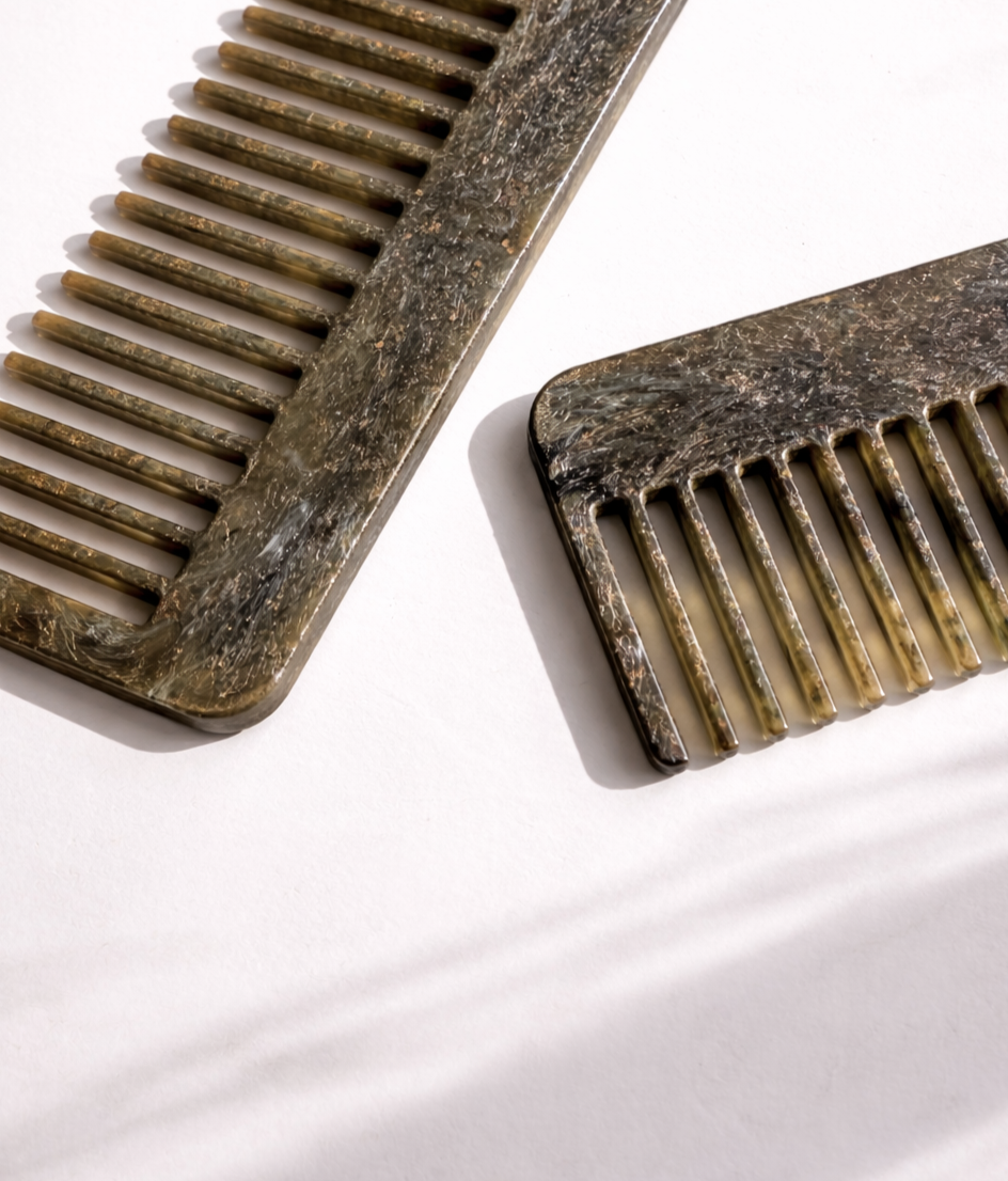 Recycled plastic hair comb pair, rectangular shape, dense fine teeth.